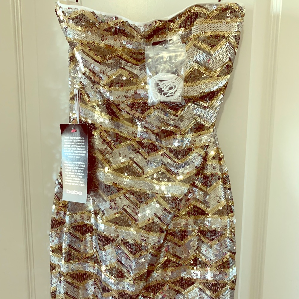 Brand new dress Bebe side xsmall